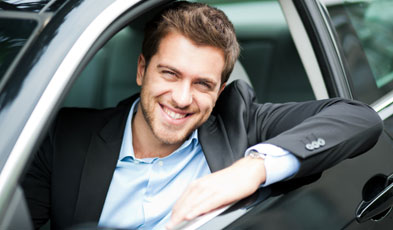 Happy Man Smiling in Car