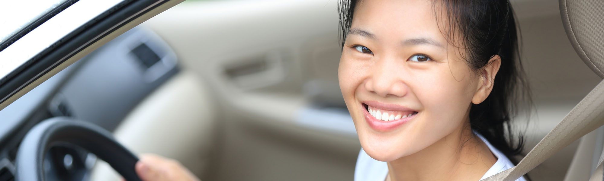 Happy Woman Smiling While Driving